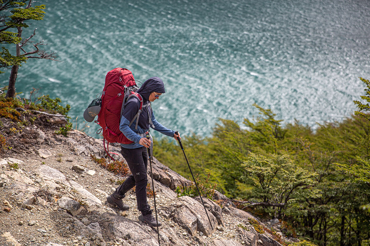 Osprey Ariel 65 backpacking pack (hiking down rocks above water)